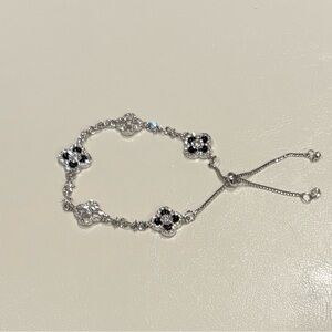 Elegant Silver Clover Bracelet with Black & White Accents
